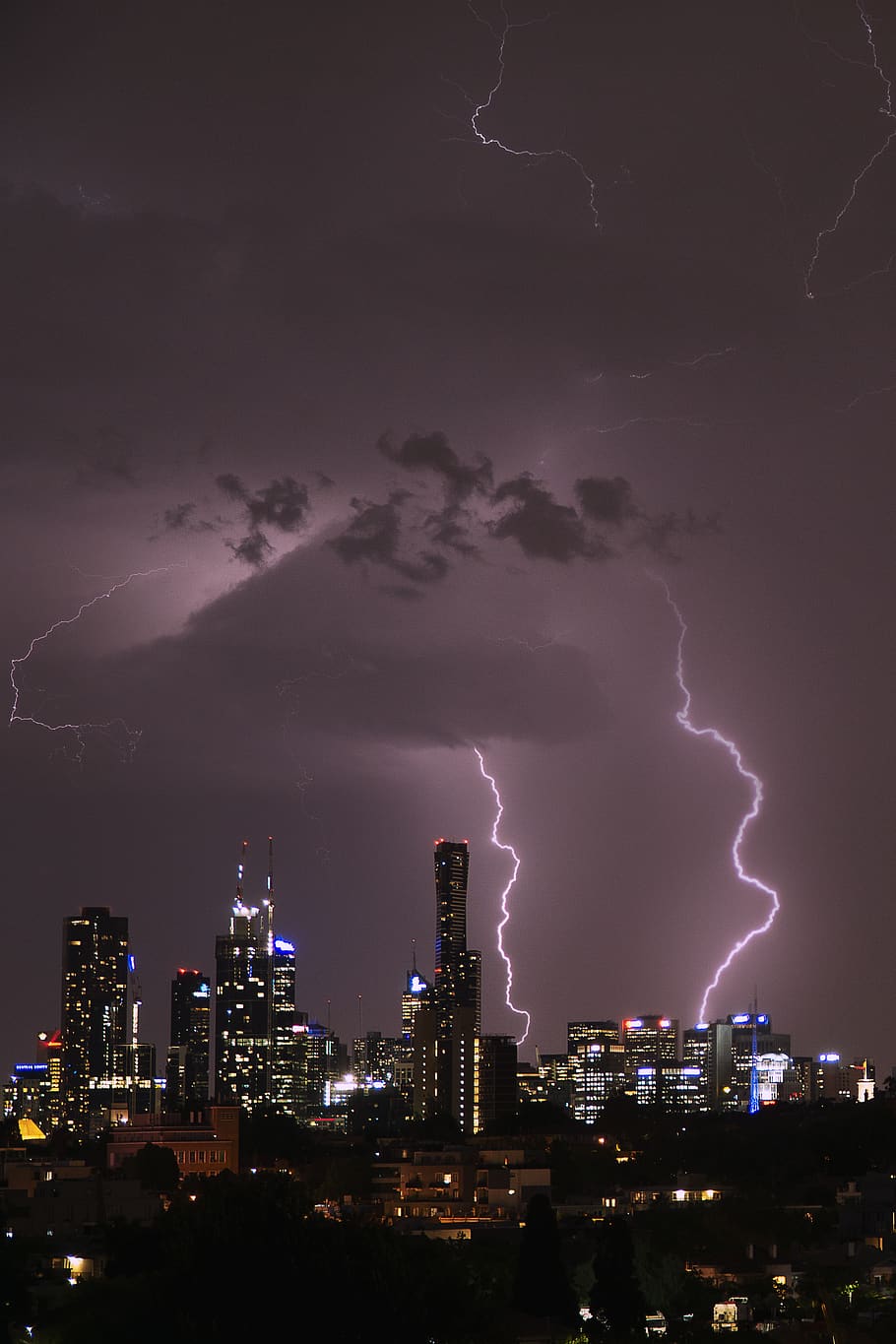 time lapse photography of highrise building under lightning, nature