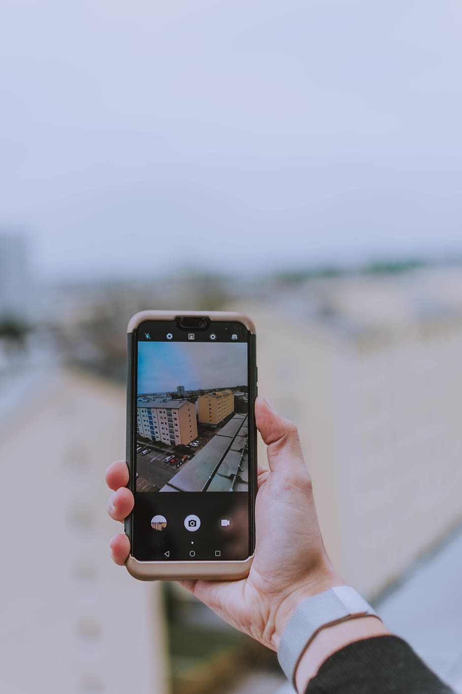 Person Taking Photo of Building \, blurred background, cellular telephone HD wallpaper