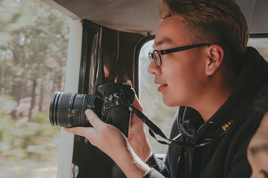 Photo of Man Holding Nikon Dslr Camera, boy, capture, eyeglasses HD wallpaper
