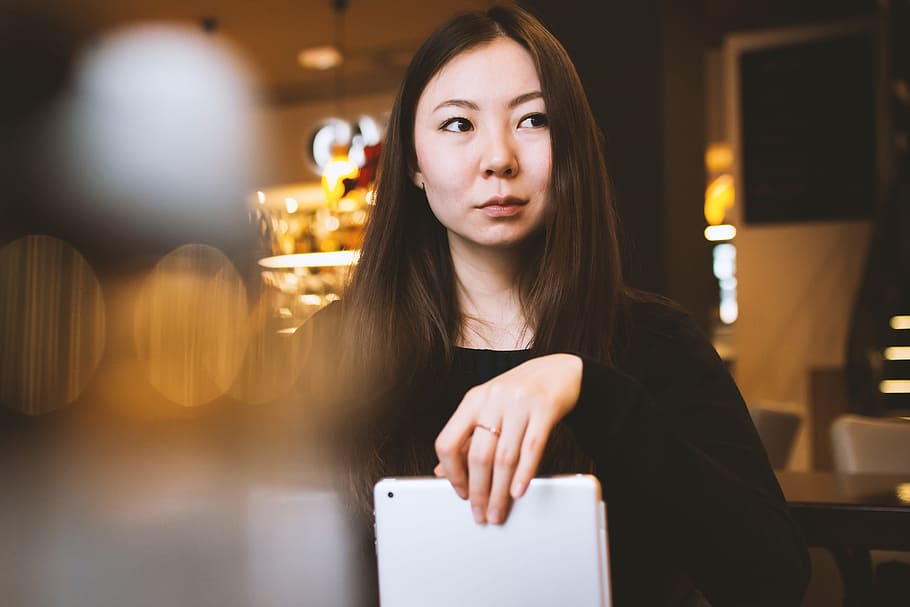 Young college student in a cafe with tablet in hand, young adult HD wallpaper