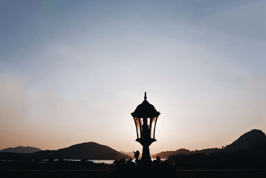sunset, sky, blue, orange, mountain, river, natural, lamp, silhouette HD wallpaper