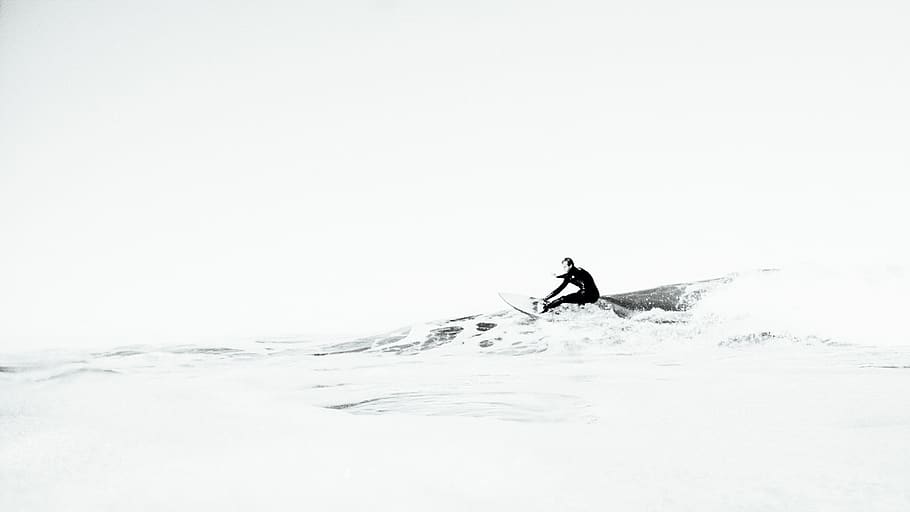 A surfboarder riding a small wave., beach wallpapers, beach background HD wallpaper