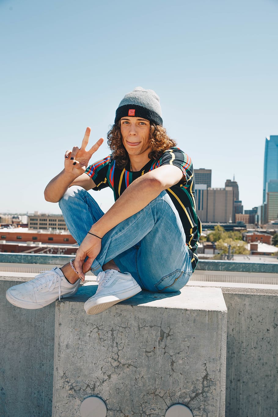 HD wallpaper: man sitting on concrete block doing peace hand sign, one ...