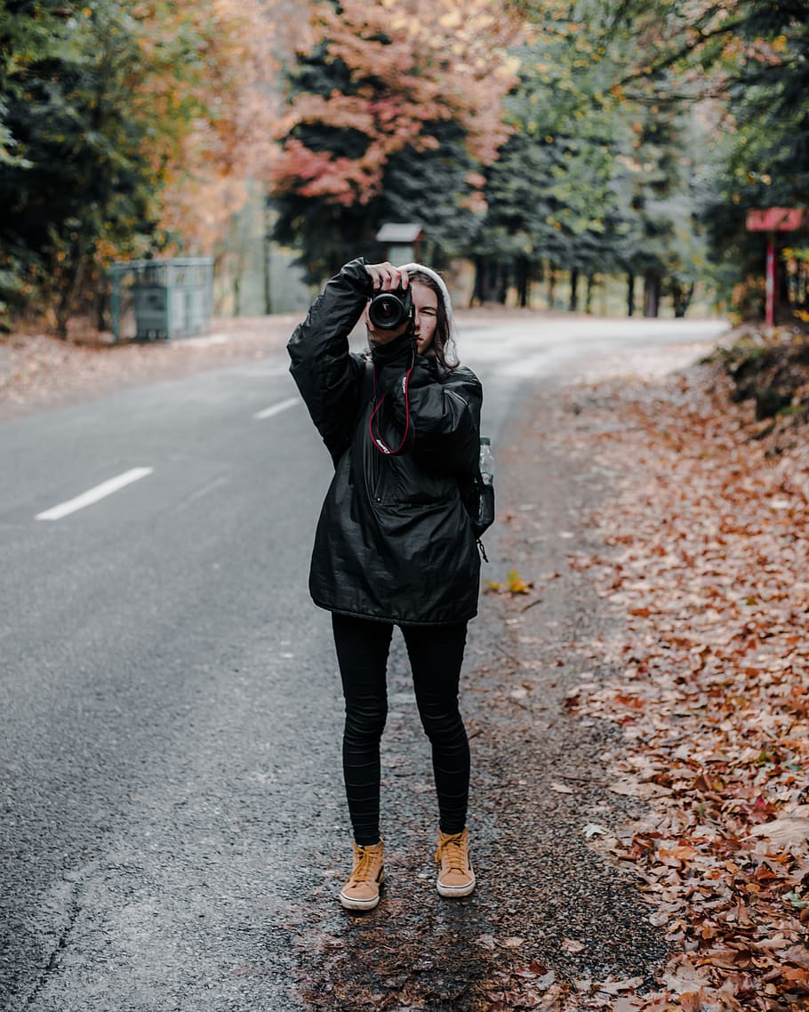 man holding camera standing on road, apparel, footwear, shoe HD wallpaper