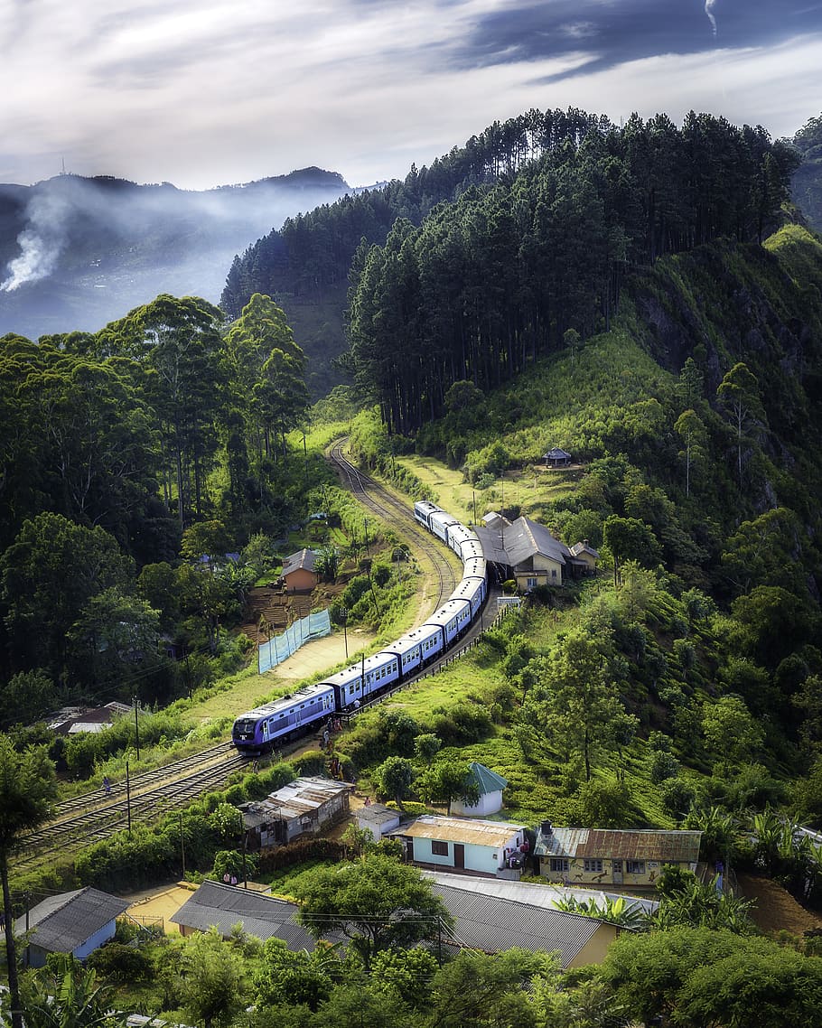 Photo Of Railway On Mountain Near Houses, bird's eye view, curve
