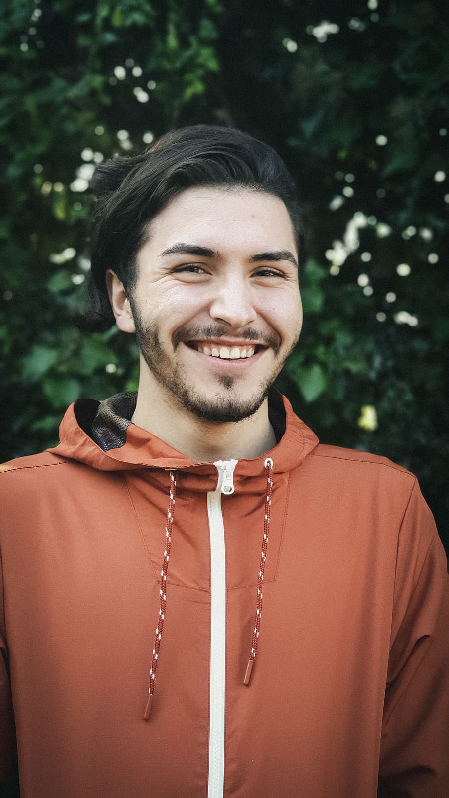 smiling man wearing orange zip-up jacket, face, person, human, HD wallpaper