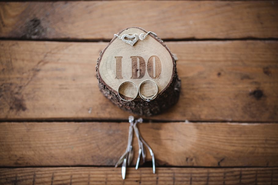 two silver-colored rings on slab, wood - material, indoors, no people HD wallpaper