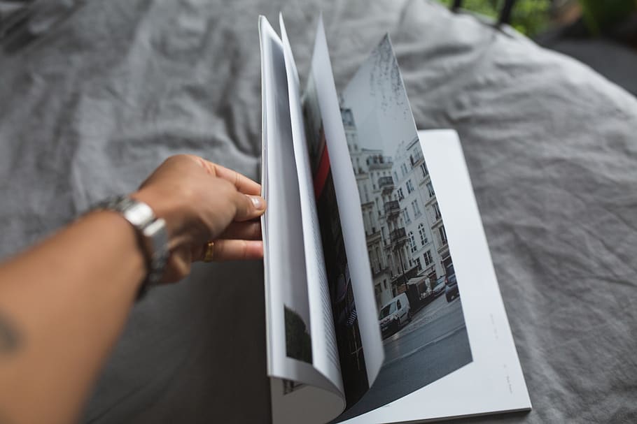 person scanning book, human, paper, wristwatch, hand, magazine HD wallpaper