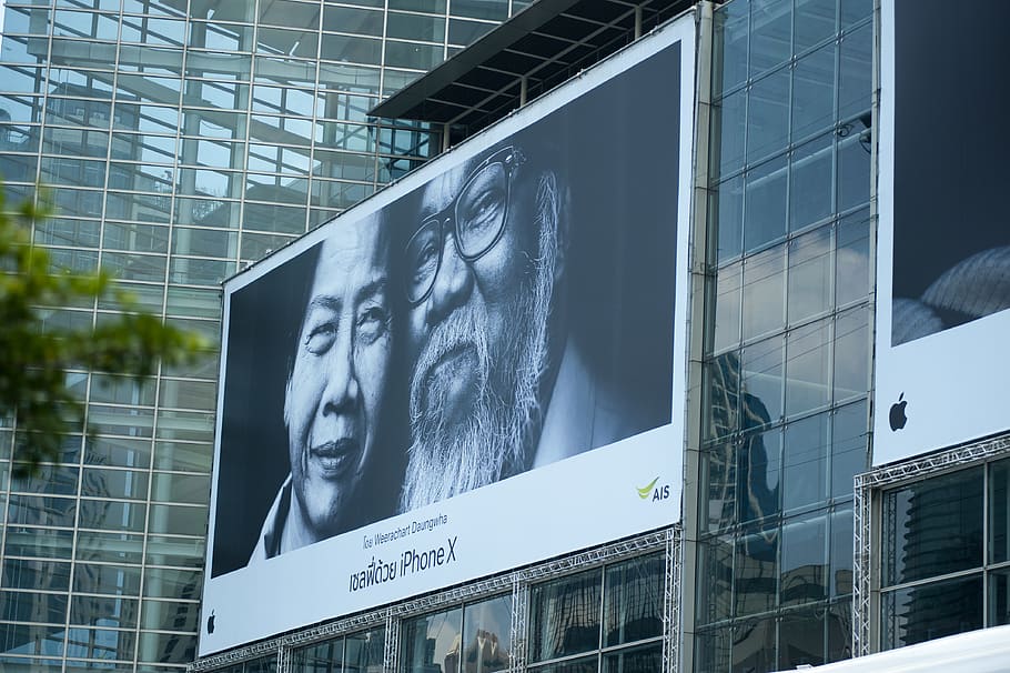 Man Beside Woman Billboard, advertisement, architectural design HD wallpaper