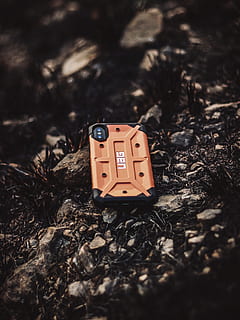 rectangular orange and black UAG smartphone on ground, wristwatch HD wallpaper