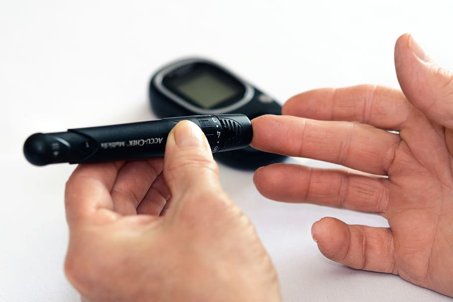 Person Holding Black Tube, checking, close-up, diabetes, diagnosis
