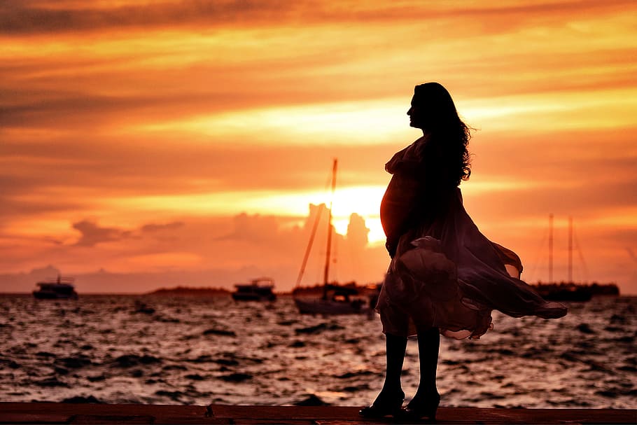 Pregnant Woman Standing Near Seashore during Sunset, backlit HD wallpaper