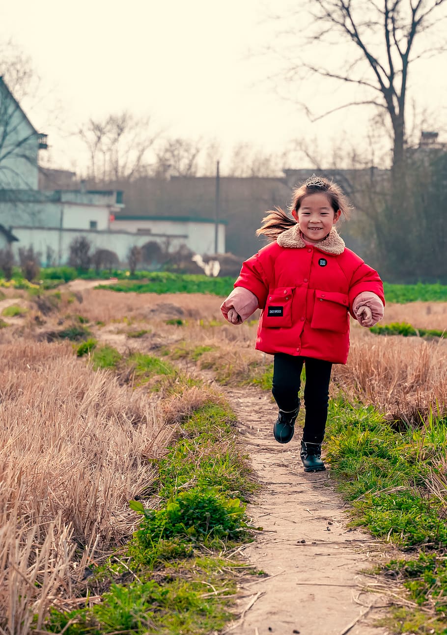 running girl wearing red jacket, clothing, apparel, outdoors