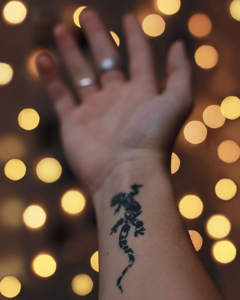 Tiny Horseshoe Finger Tattoo
