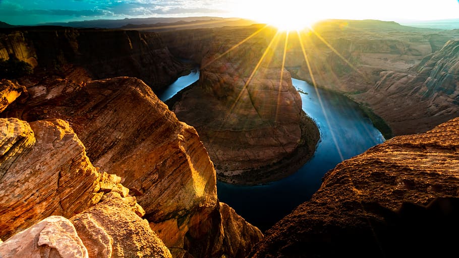 landscape photography of canyon, sunlight, flare, glow, rock