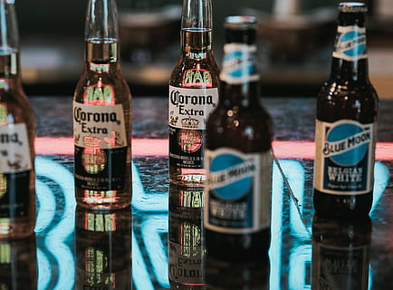 Corona Extra beer bottles on gray marble surface, drink, beverage HD wallpaper