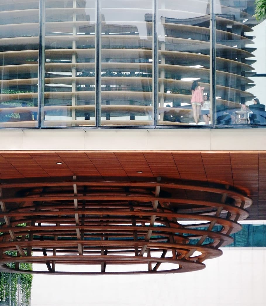 Archidecturial details of a large wooden cone shaped feature on a highrise building HD wallpaper