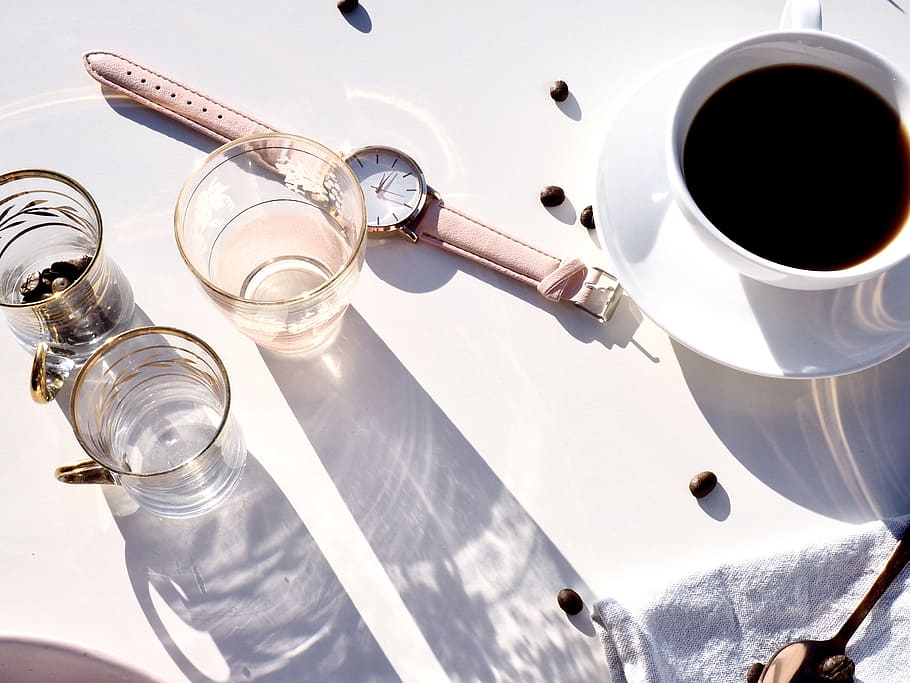 flat lay photography of glasses, wristwatch, and teacup on white surface HD wallpaper