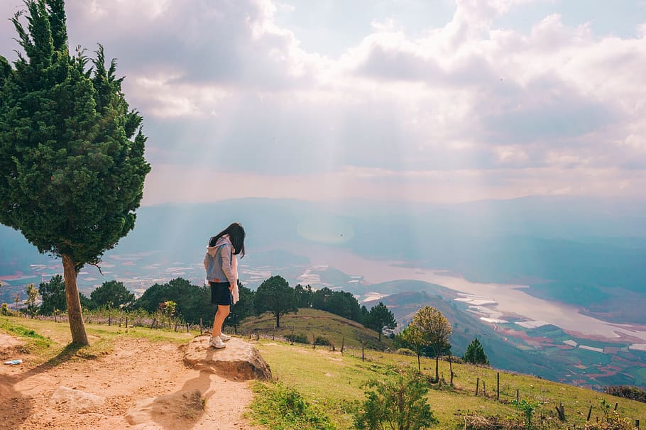 Woman Standing on Stone Near Tree, clouds, daylight, environment HD wallpaper