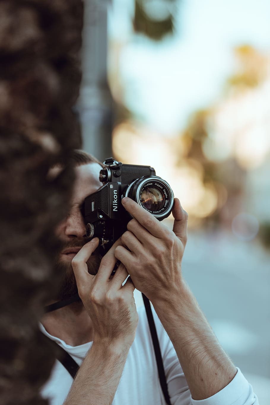 person using black Nikon DSLR camera, photographer, bokeh, blur, HD wallpaper