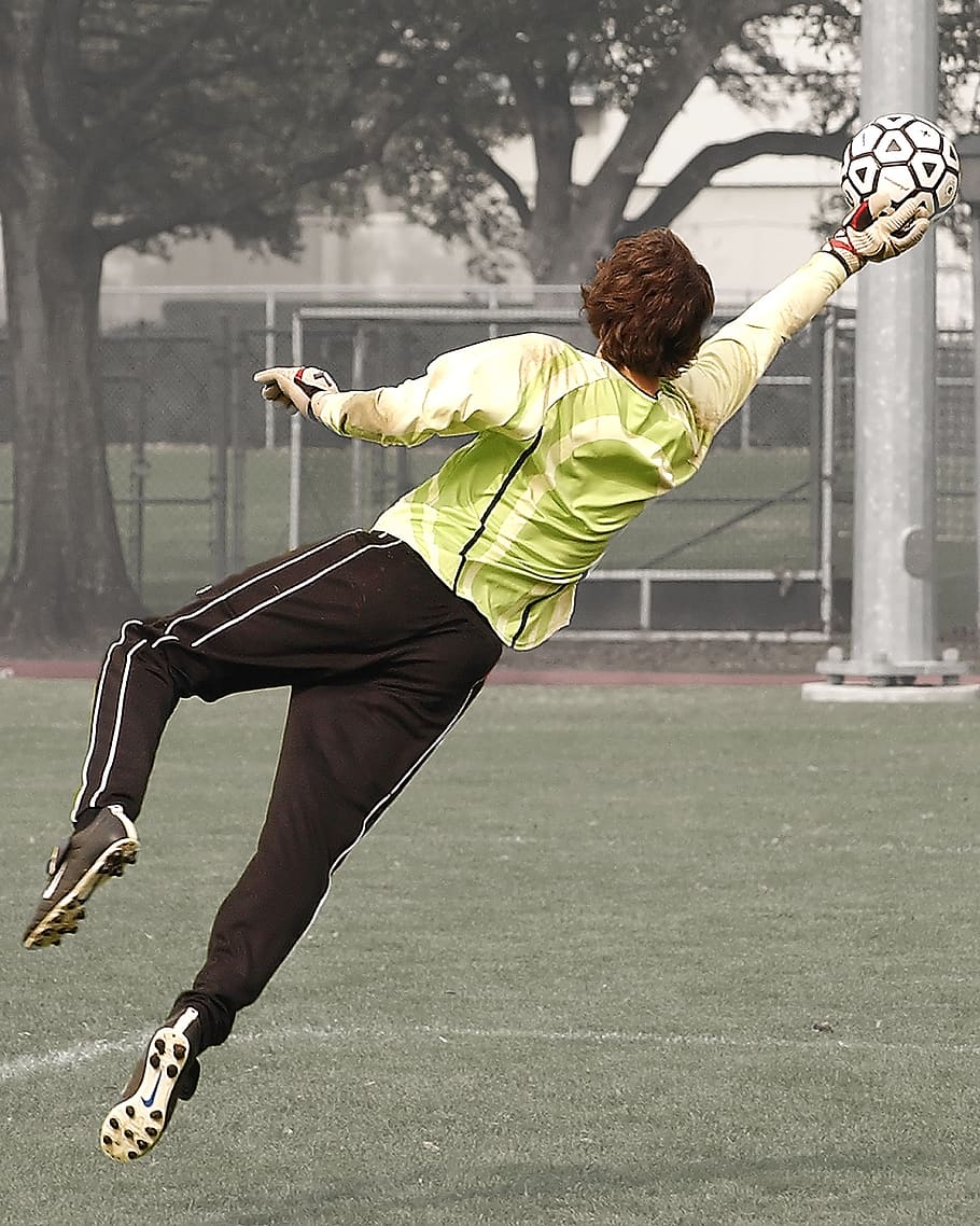 Goalee Player Holding Black and White Soccer Ball, action, athlete