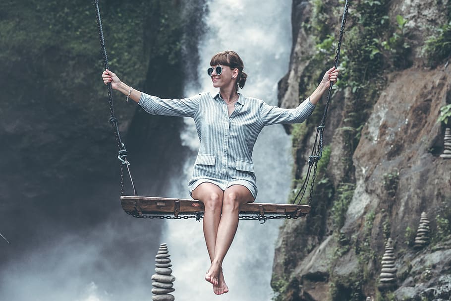 Photo of Woman Riding Swing in Front of Waterfalls, background HD wallpaper