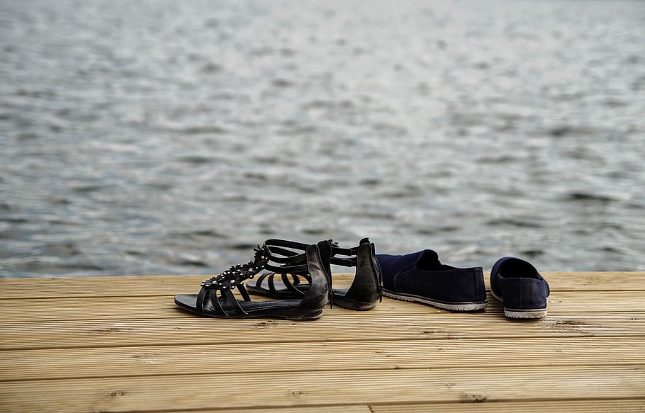 Two Pairs of Sandals on Wood Floor, daylight, dock, water, wooden