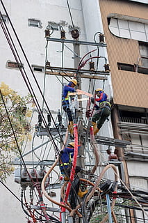 three people climbing on electric post, human, person, jl embong malang HD wallpaper