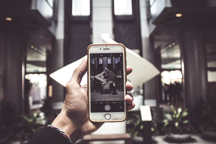 Person Holding Iphone Taking Photo Of Statue, device, electronics, HD wallpaper