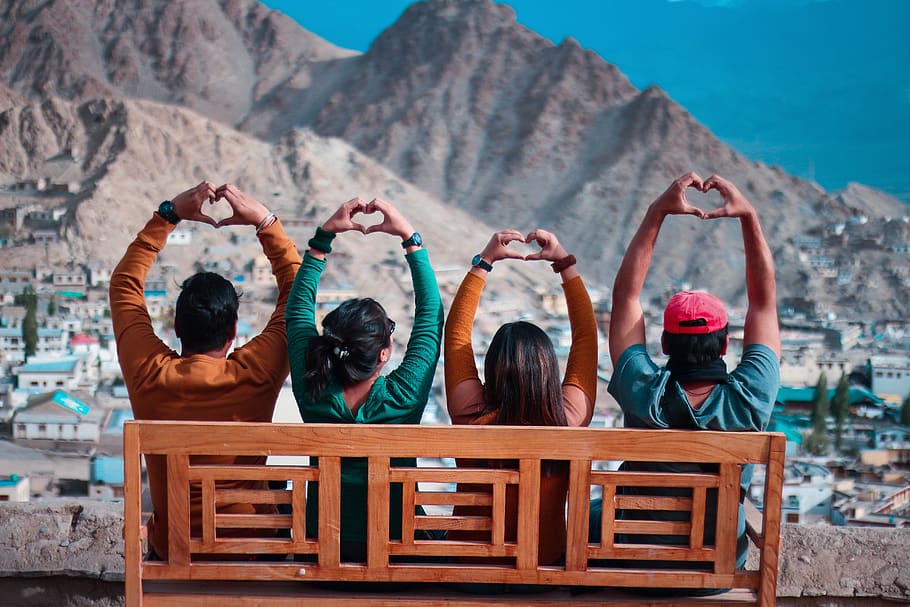 Four People Making Heart Hand Sign While Sitting, bench, men HD wallpaper