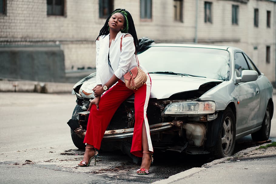 Woman in White Open Cardigan and Red and White Pants Sitting on Damage White Car, HD wallpaper