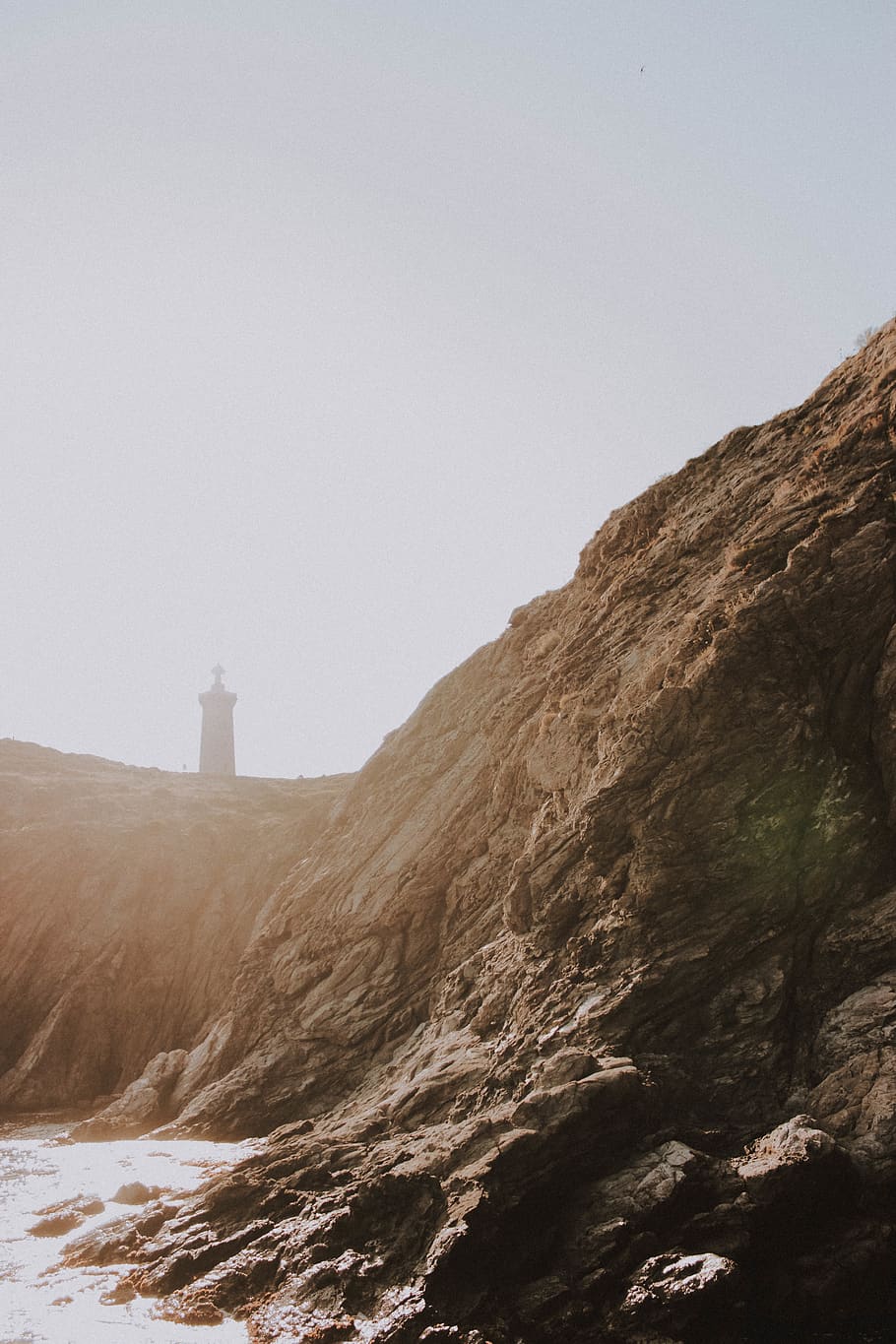 brown soil, nature, cliff, rock, lighthouse, mountain, mountain range HD wallpaper