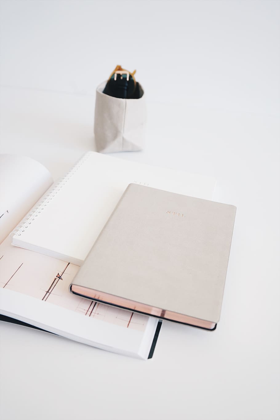 three assorted-color notebooks, file binder, table, paper, furniture HD wallpaper