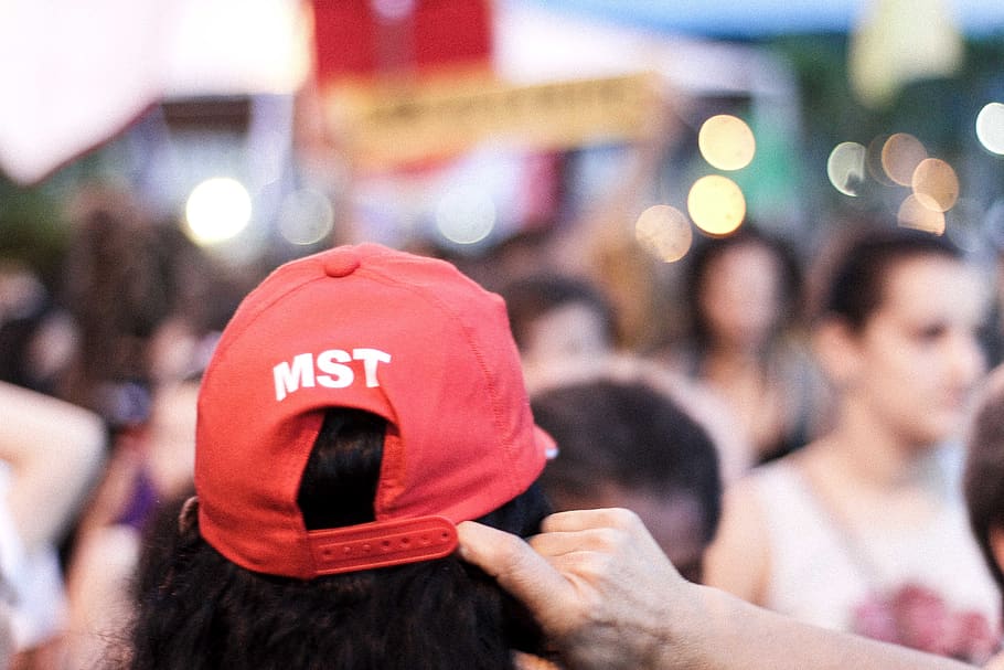 clothing, apparel, person, human, finger, hat, cap, hair, crowd