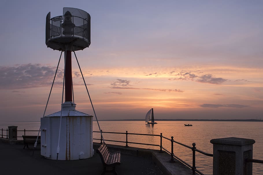 lighthouse, sunset, yacht, evening, sea, sky, clouds, twilight HD wallpaper
