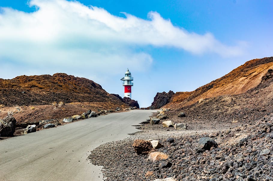 lighthouse, road, mountains, red, landscape, travel, clouds HD wallpaper