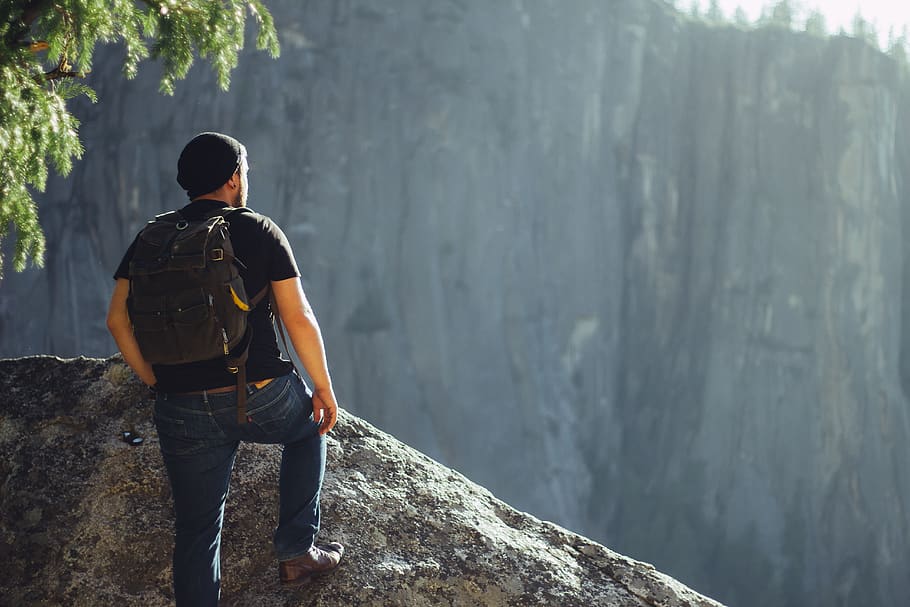 man standing on gray stone, real people, one person, rear view HD wallpaper