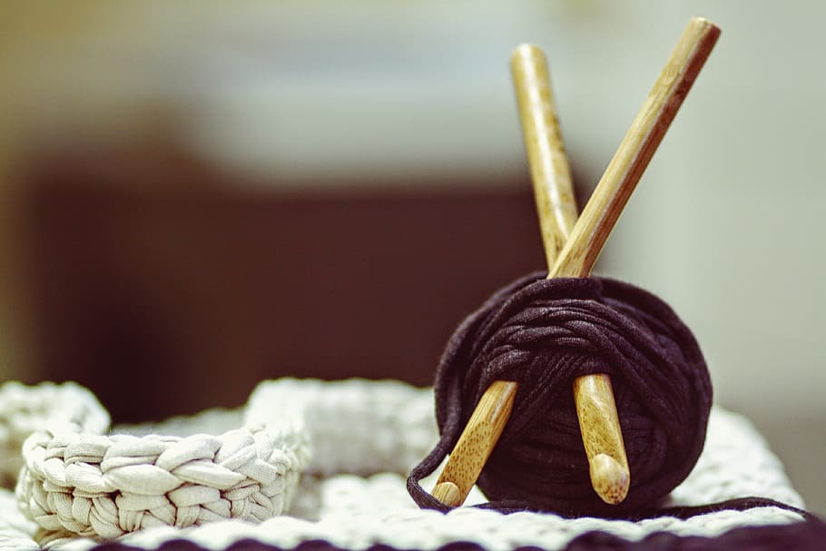 Brown Wooden Rod and Purple Yarn Ball Beside White Braided Cloth HD wallpaper