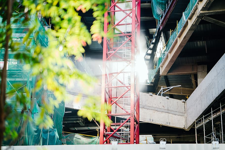Green Leafed Tree Beside Red Metal Trusses and Building, architecture HD wallpaper