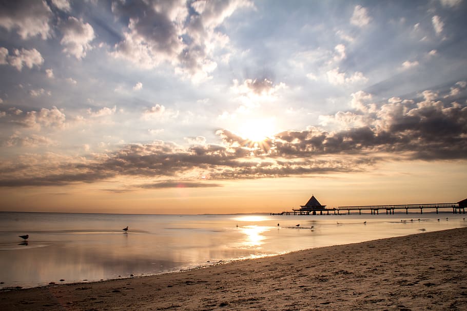 Sunset Viewed on Ocean, beach, clouds, coast, dawn, pier, sand HD wallpaper