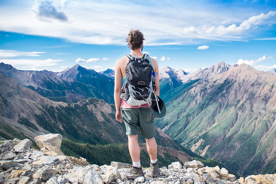 man standing on cliff facing mountain range, leisure activity HD wallpaper