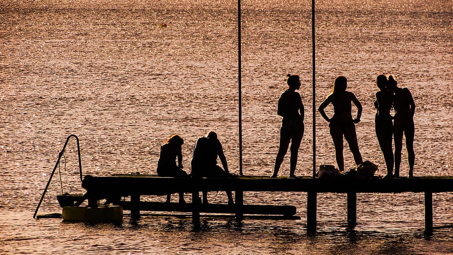Silhouette of 6 Person on Dock Near the Calm Body of Water, dawn HD wallpaper