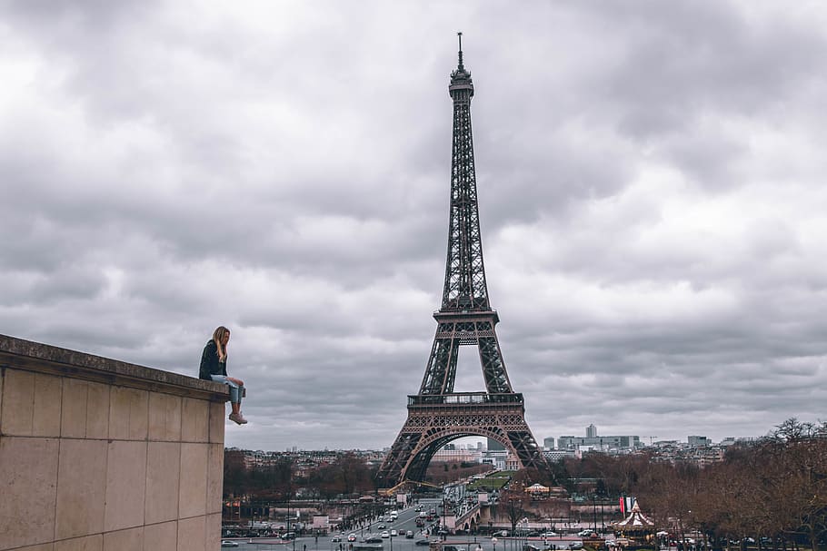 HD wallpaper: man sitting on the building watching the Eiffel Tower ...