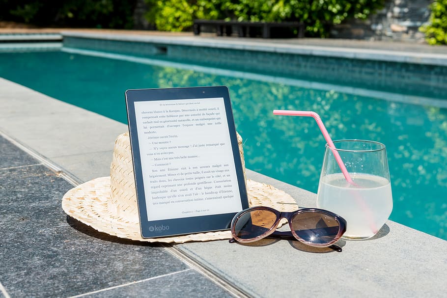 Black Kobo Table, Sunglasses, and a Glass of juice at Pool Edge HD wallpaper