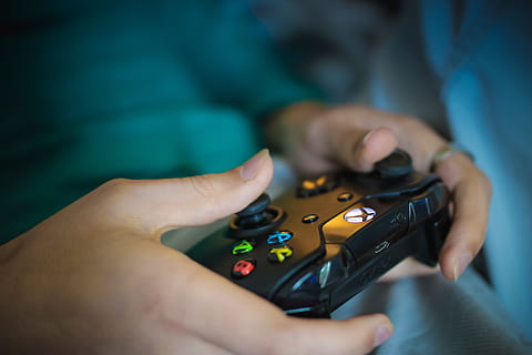 Person Holding Black Xbox Controller, blur, buttons, close-up HD wallpaper