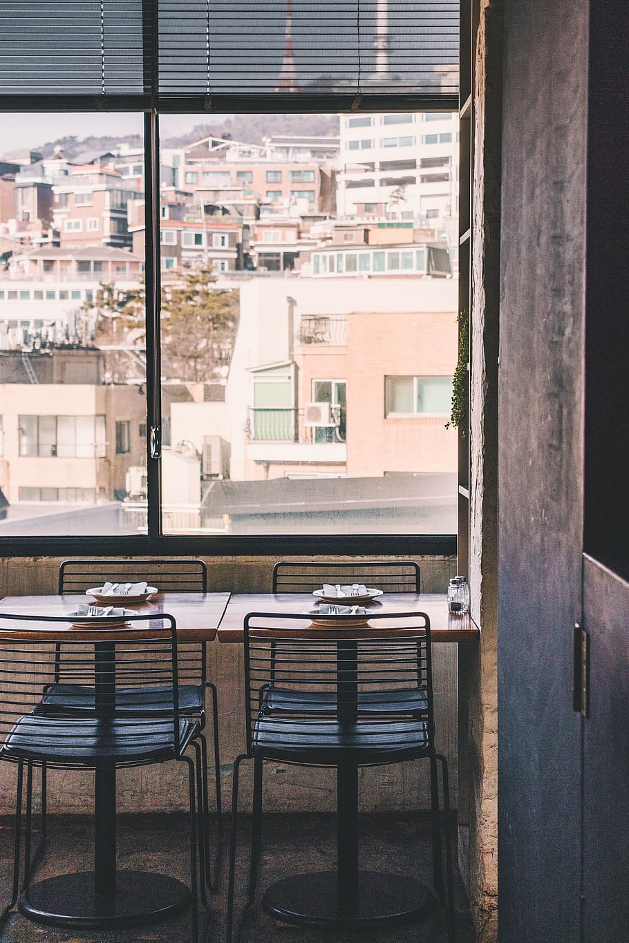 empty dining set inside room near window during daytime, built structure HD wallpaper
