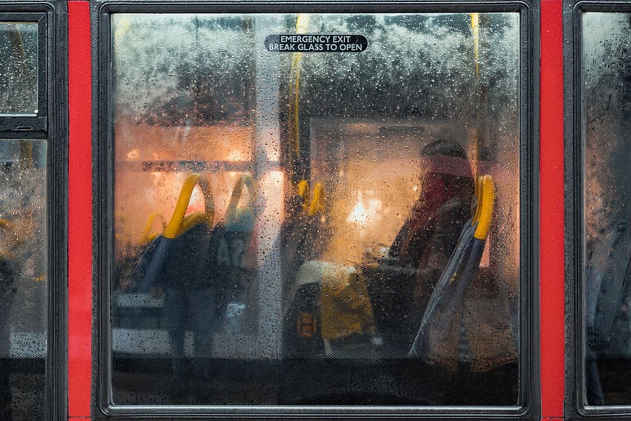 woman sitting inside a bus, window, raindrop, transport, texture
