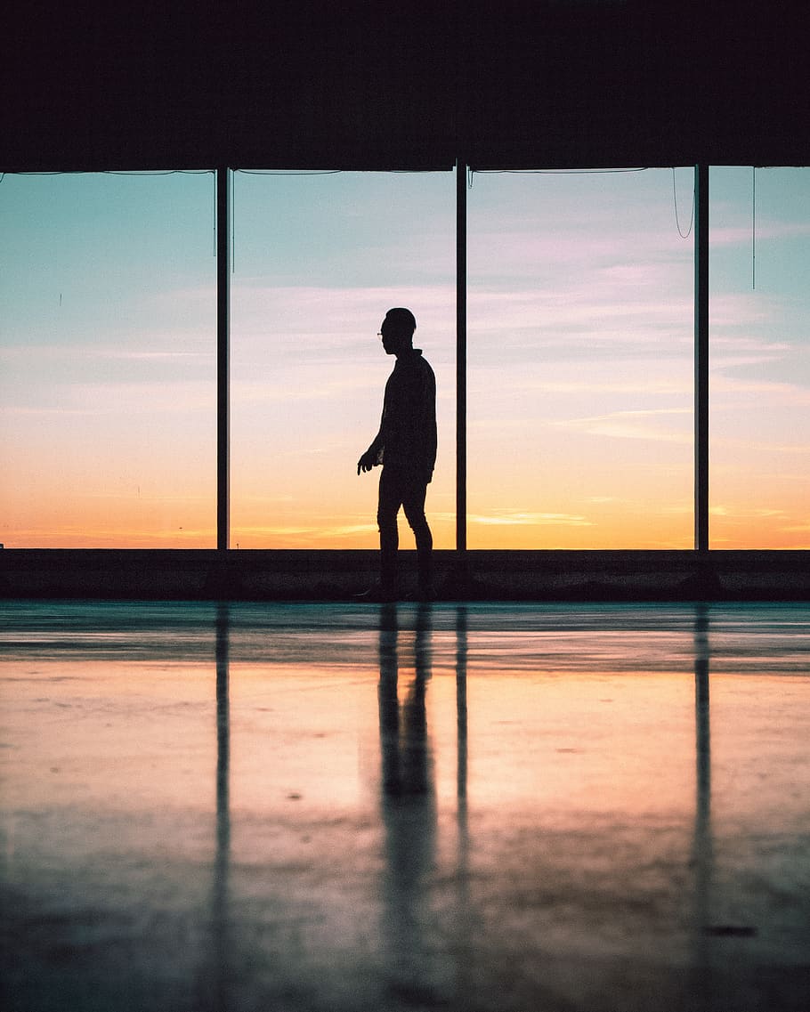 silhouette of man standing near window, person, human, flooring