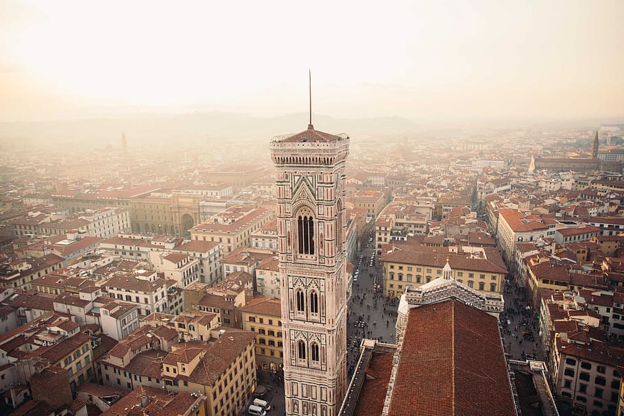 Towers in Florence, Italy surrounded by clay rooftops of residences