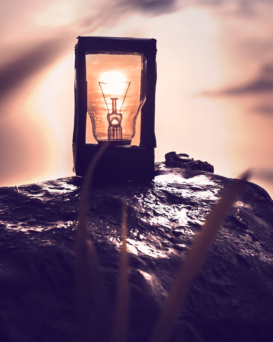 Orange Light Bulb on Rock, lamp, landscape, lightbulb, lights HD wallpaper